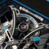 the skeletonized dial has a strong mechanical feel, can see the mainspring barrel.
