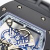 skeletonized dial with grade 5 titanium baseplate and double mainspring barrels