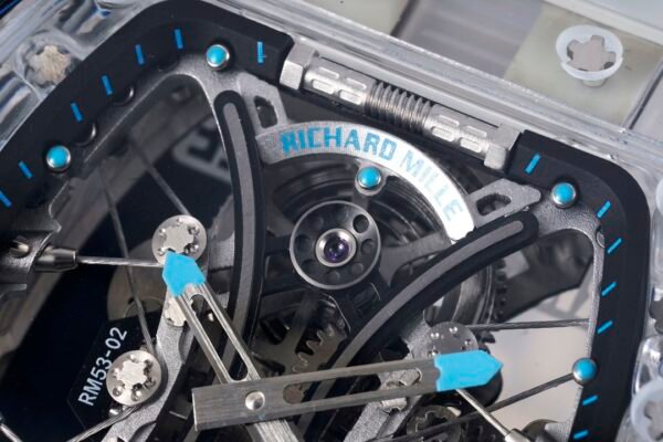 sapphire crystal case, cable-suspended movement, and clearly visible mainspring barrel.