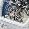 rm56-01 features a skeletonized dial with a visible tourbillon movement.