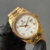 rolex daydate 40 with a white gold dial and President bracelet, paired with a business suit, exudes the elegance of a luxury timepiece.